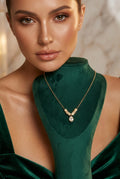 Elegant Gold-Toned Geometric V-Pendant Necklace with Teardrop Crystal