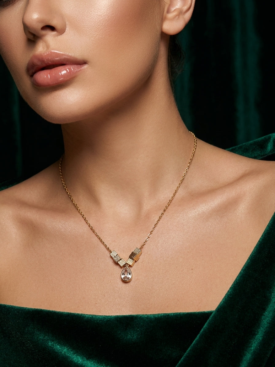 Elegant Gold-Toned Geometric V-Pendant Necklace with Teardrop Crystal