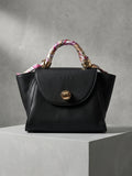 Black Chic Handbag with Scarf-Wrapped Handle and Gold Hardware