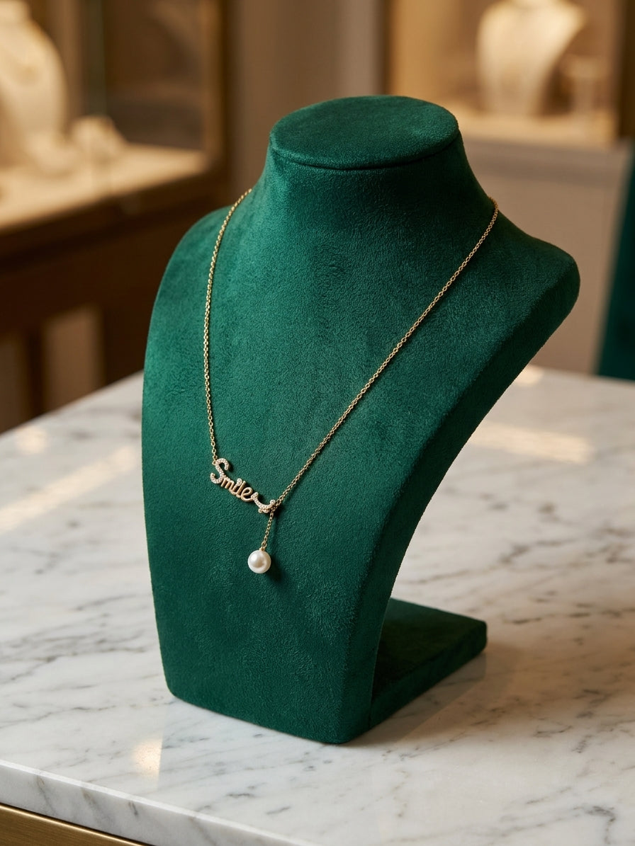 Elegant Gold-Toned "Smile" Script Necklace with Crystal Embellishments and Pearl Drop